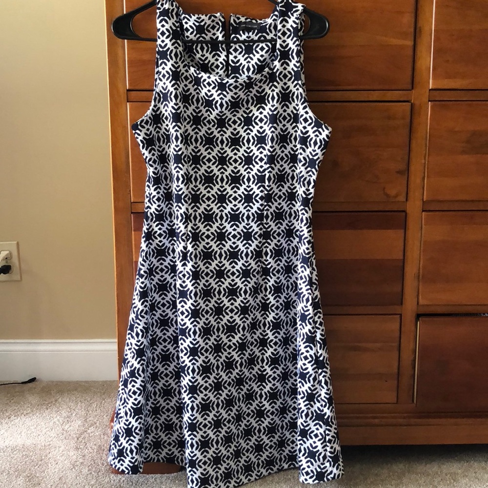 Blue and white sleeveless dress.